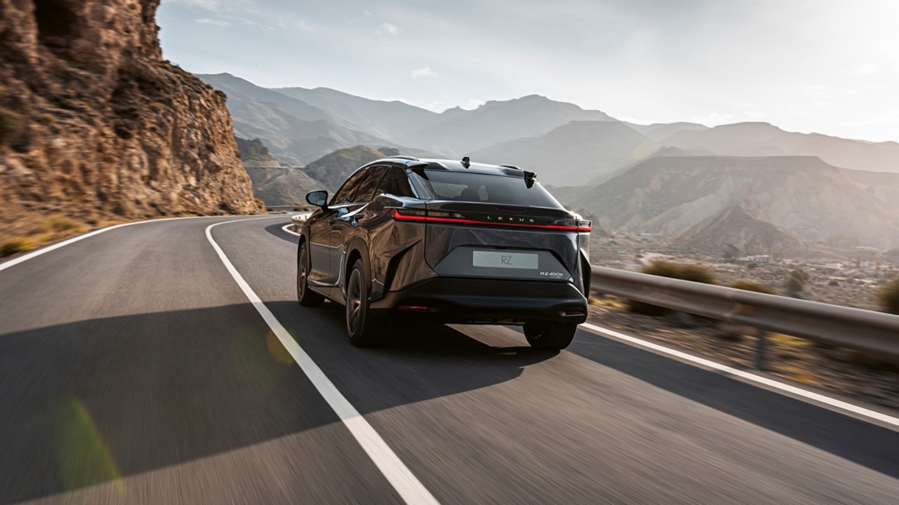 Rear view of a Lexus RZ 450e driving