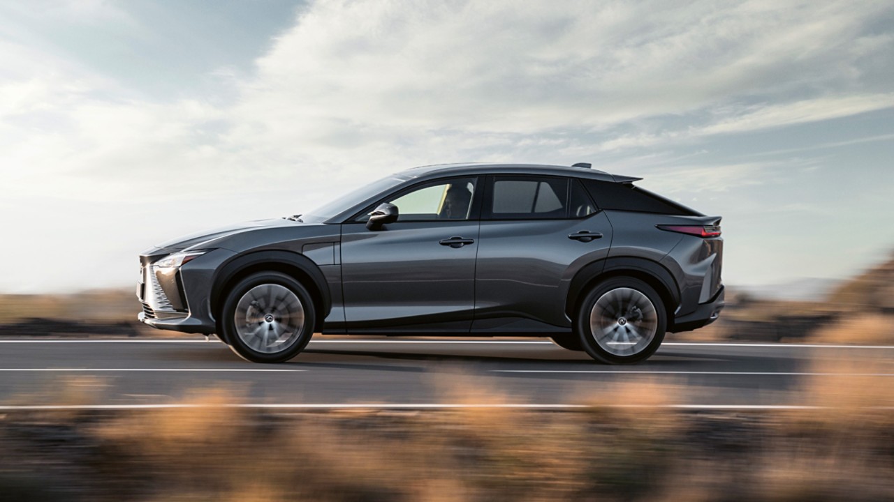 Front view of the Lexus RZ 450e driving in a rural location