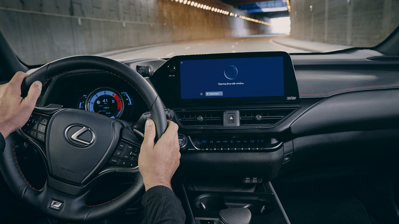 A shot of the steering wheel, dashboard and multimedia display in a Lexus UX