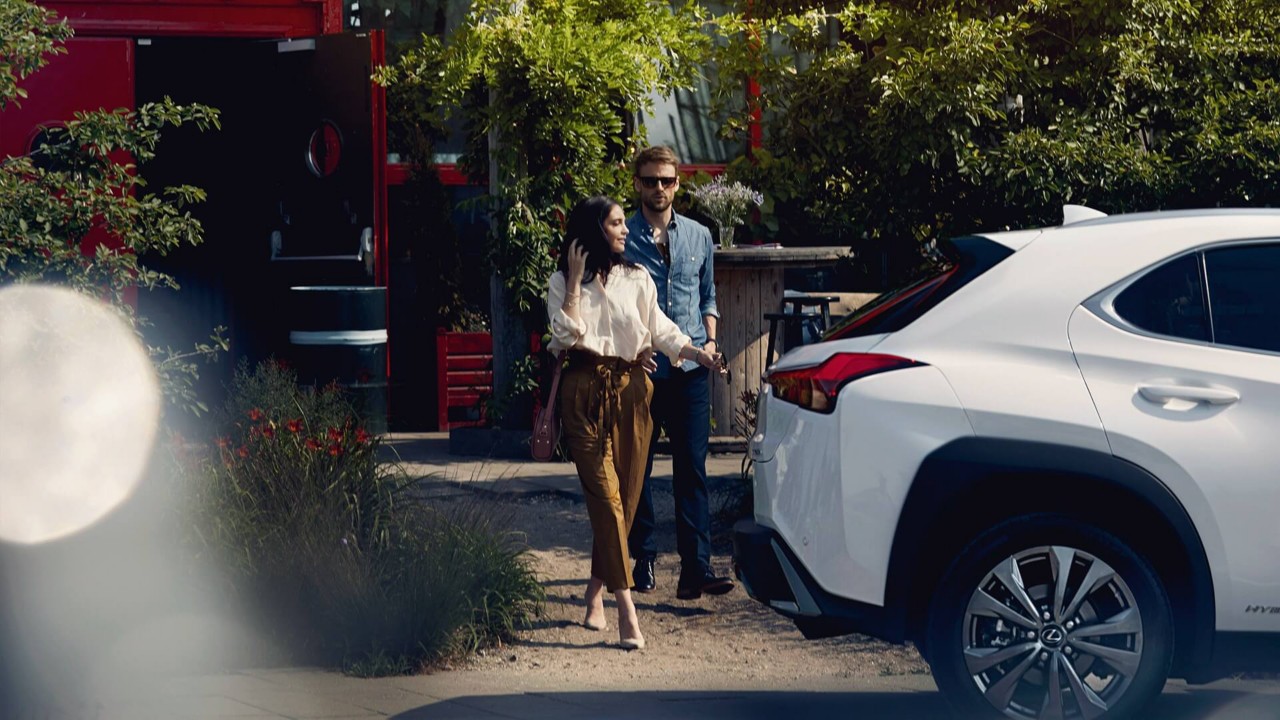 A man and woman with Lexus