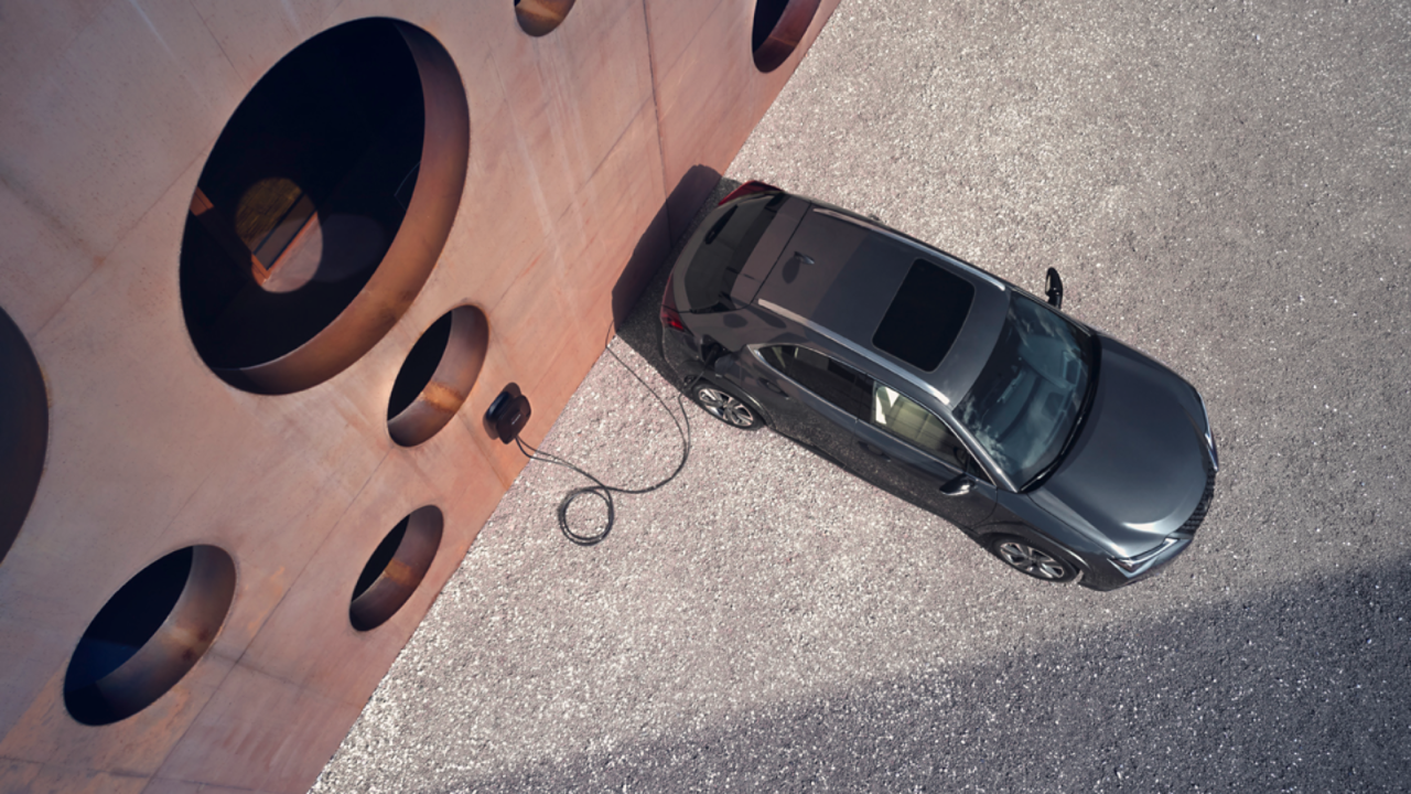 Aerial view of a plugged in Lexus UX 300e